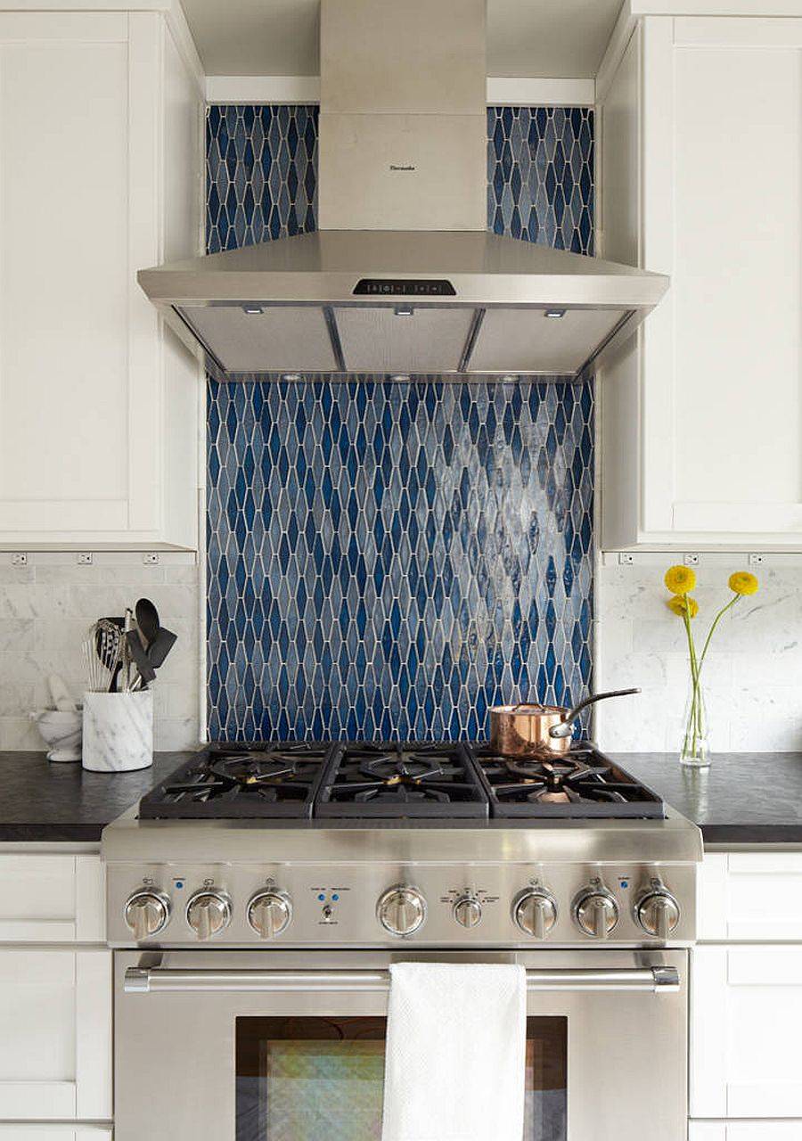 Tile with vertical pattern in blue adds a vibrant focal point to this kitchen in neutral colors