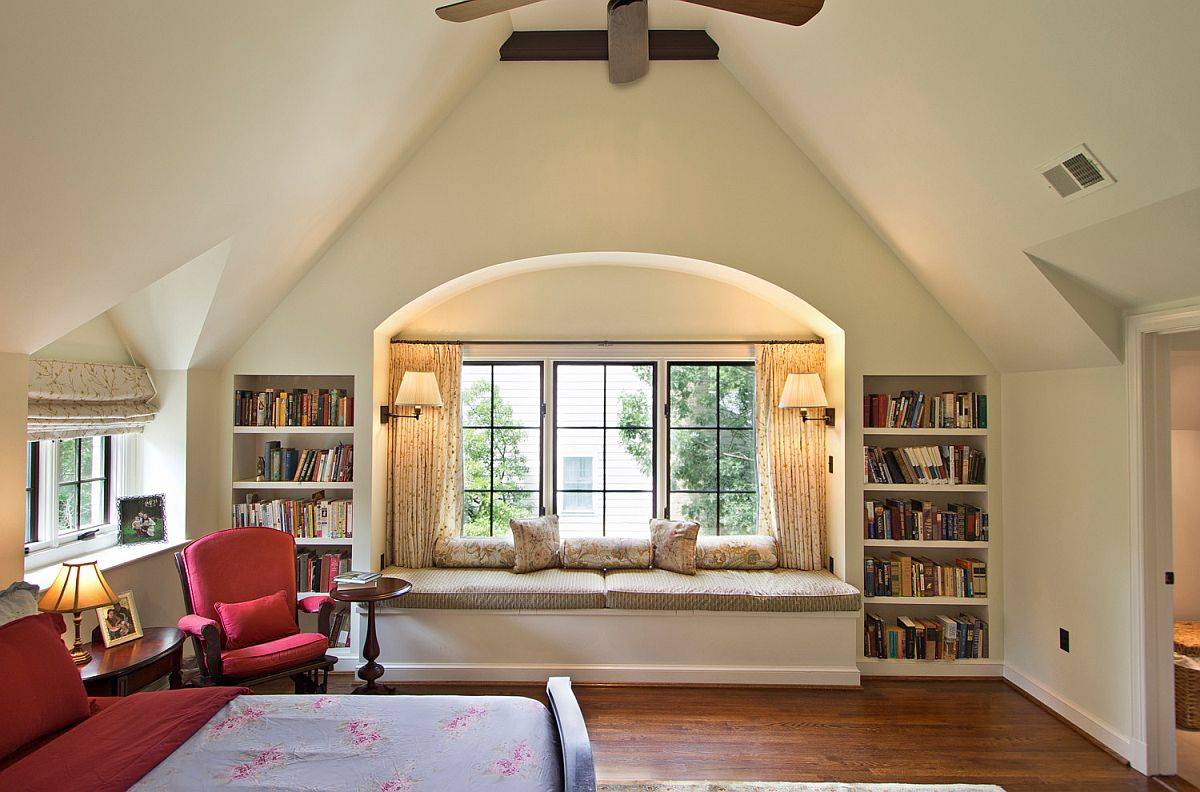 Bookshelves on either side of the window seat make it a unconfined little space for bibliophiles