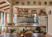 Busy-modern-eclectic-kitchen-with-a-smart-wood-topped-kitchen-island-at-its-heart-75198-217x155