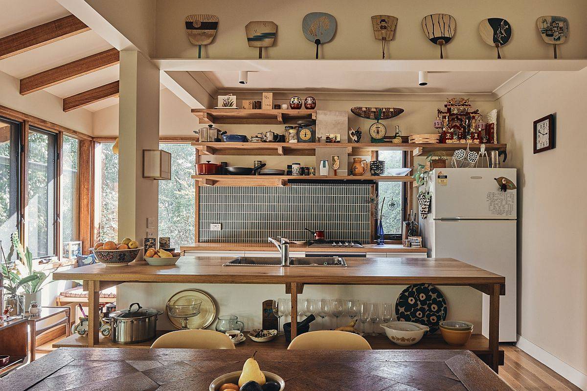 Busy modern eclectic kitchen with a smart wood-topped kitchen island at its heart