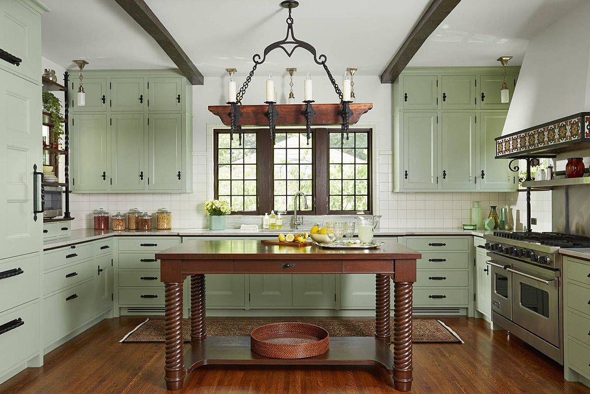 Classic Mediterranean style is coupled with modern overtones in this white and green kitchen