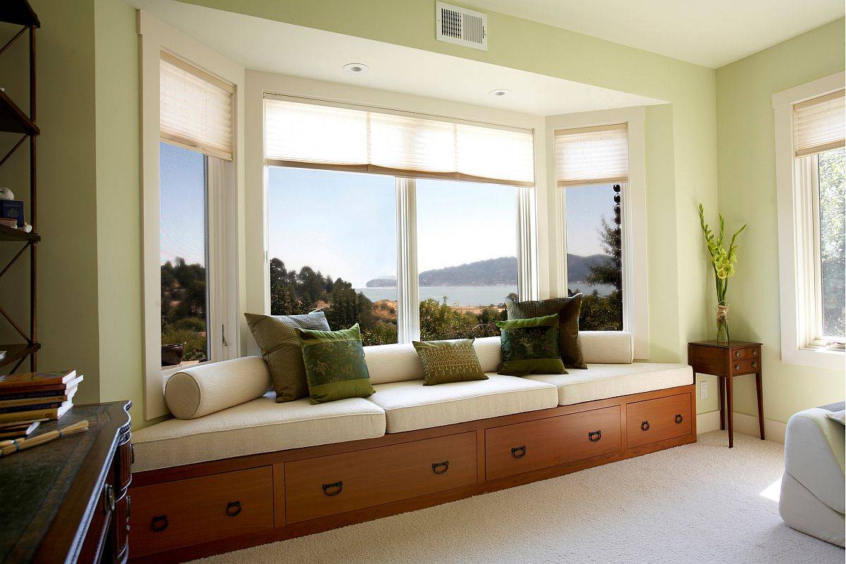 Gorgeous bedroom window seat perfectly frames the amazing mountain and water views in the distance