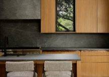 Minimal-modern-kitchen-in-stone-and-wood-with-a-dark-backsplash-66969-217x155