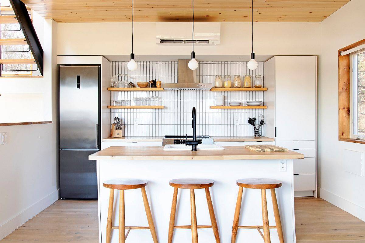 Small and space-savvy contemporary kitchen of New York home with a wood and white color scheme