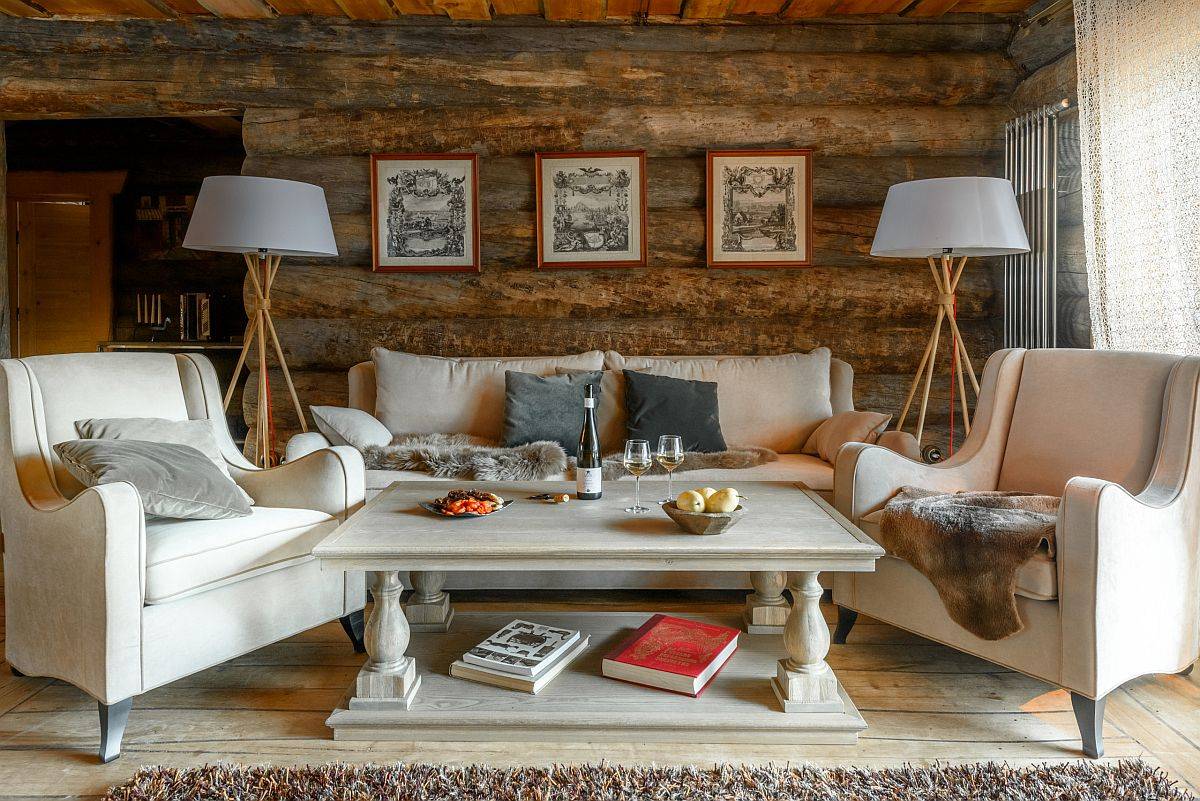 Small rustic living room with wooden logs that create the backdrop