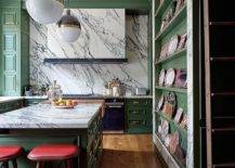 Stunningly-beautiful-marble-stone-slab-backsplash-also-covers-the-hood-in-this-kitchen-with-green-cabinets-53871-217x155