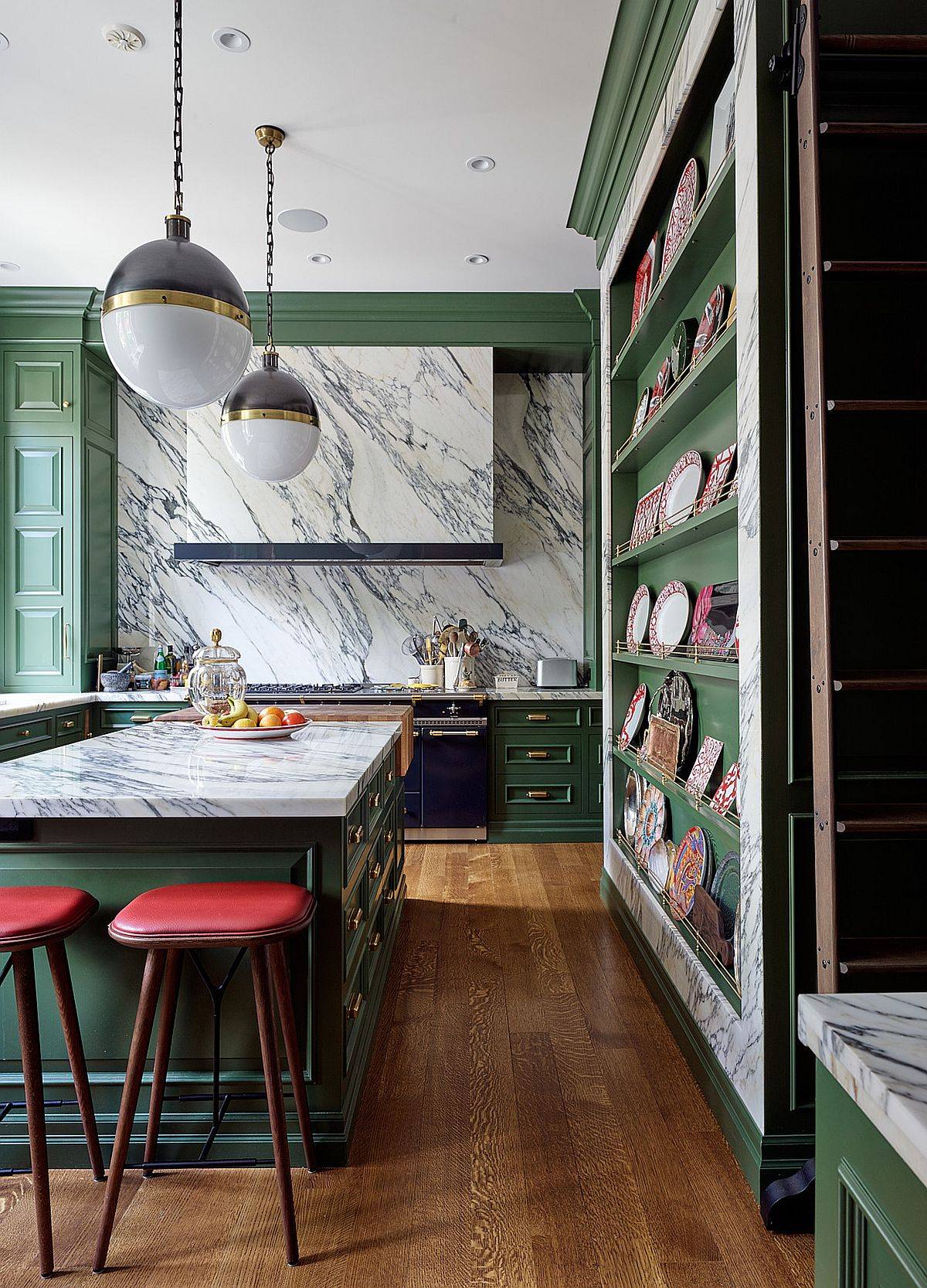 Stunningly-beautiful-marble-stone-slab-backsplash-also-covers-the-hood-in-this-kitchen-with-green-cabinets-53871