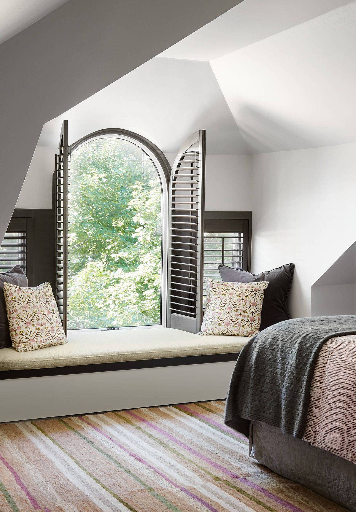 Unique window design makes this bedroom window seat extra special
