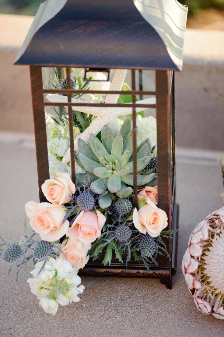 Lantern decorated with succulents (from Deer Pearl Flowers)--succulent-wedding-centerpieces-centerpiece-ideas