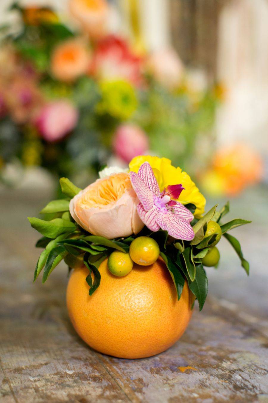 Orange centerpiece (from Style Me Pretty)