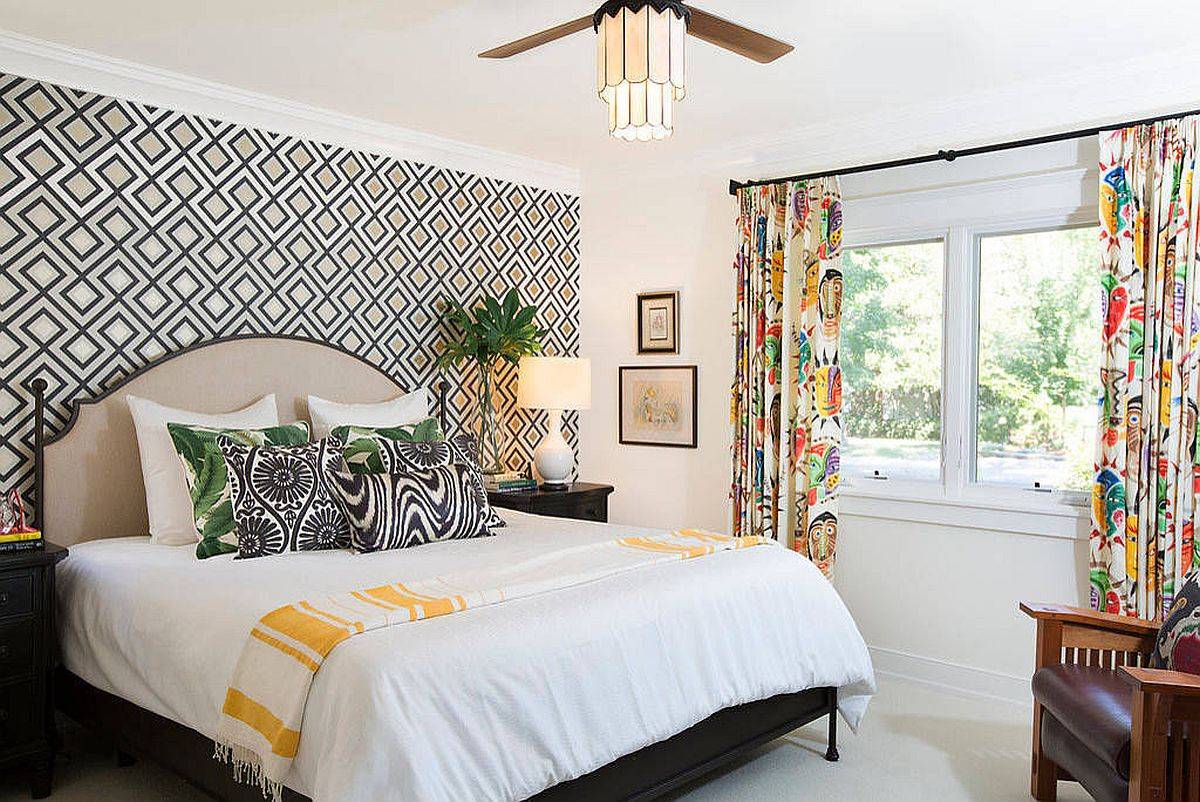 Bold Hick's wallpaper and drapes add both pattern and color to this contemporary bedroom