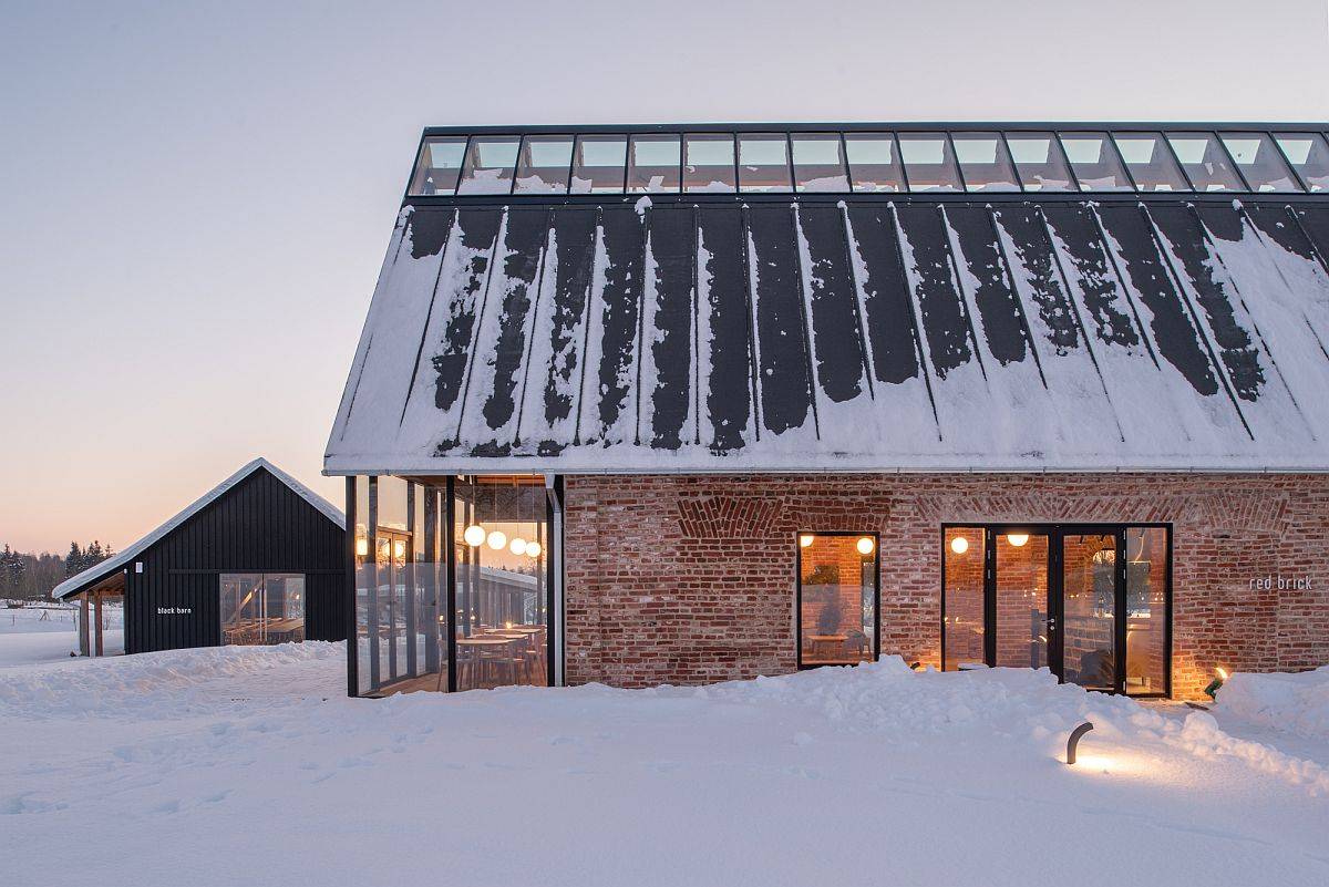 Brilliant blend of modern glass walls with industrial building in brick and metal