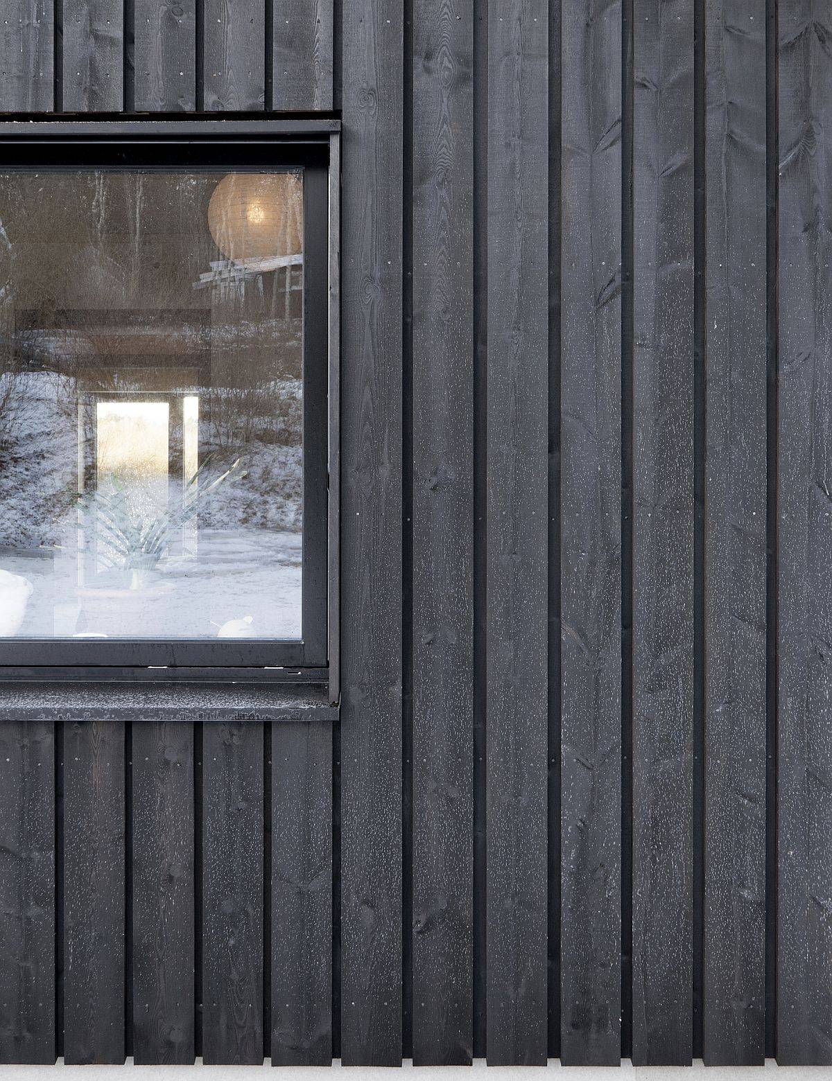 Cross-laminated-wood-treated-with-black-tar-shape-the-exterior-of-this-countryside-Swedish-home-44806