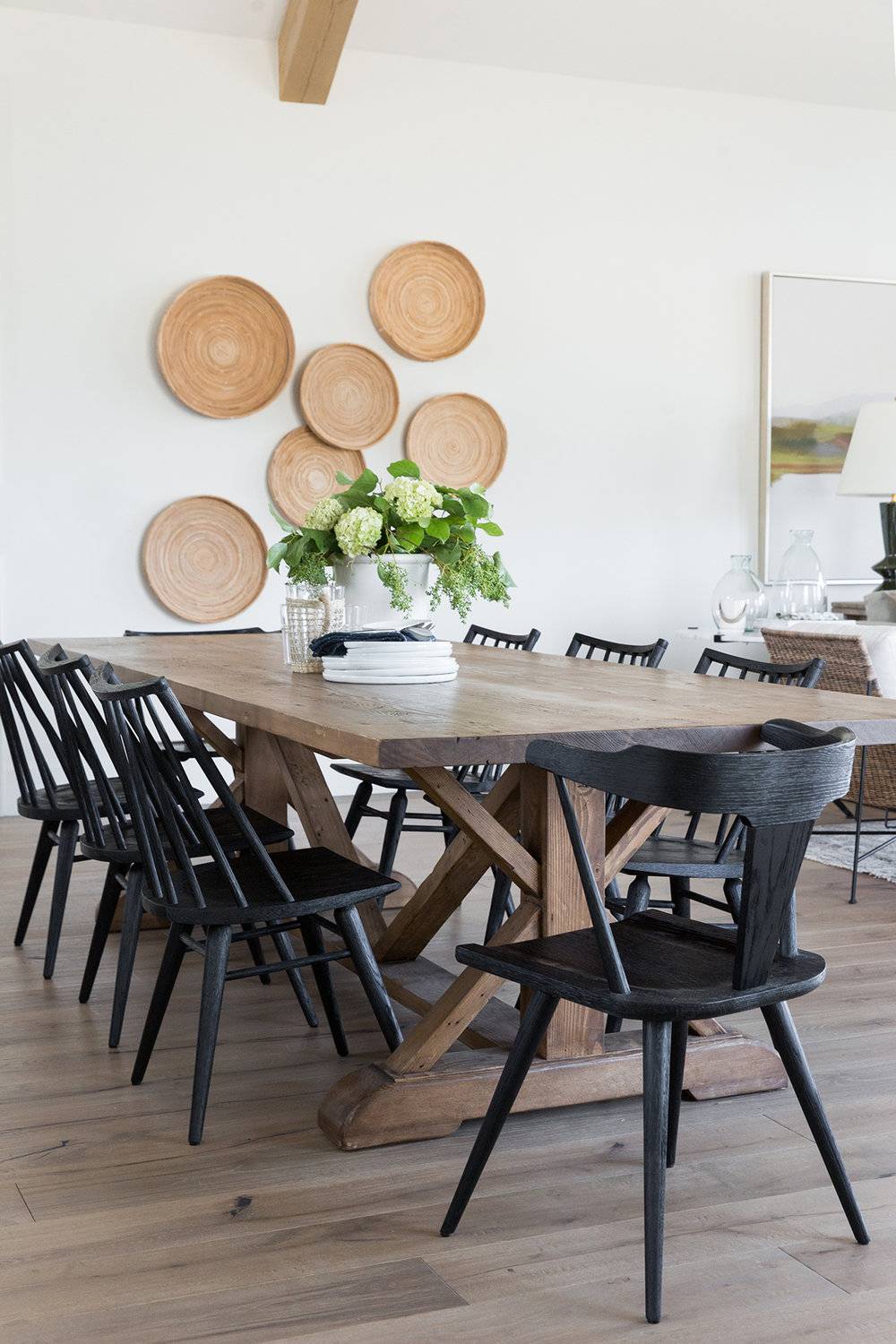 Diningroomwithexposedbeamsmismatchedchairsblackchairsinmountainhome-StudioMcGeeDesign-85145