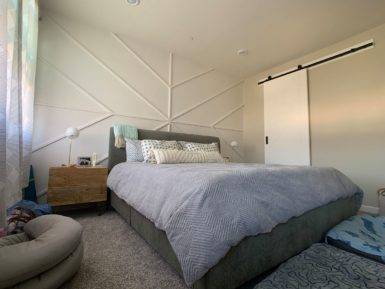 Geometric Accent Wall In White Leaves The Color Scheme Of This Small Bedroom Undisturbed 69069 385x289 