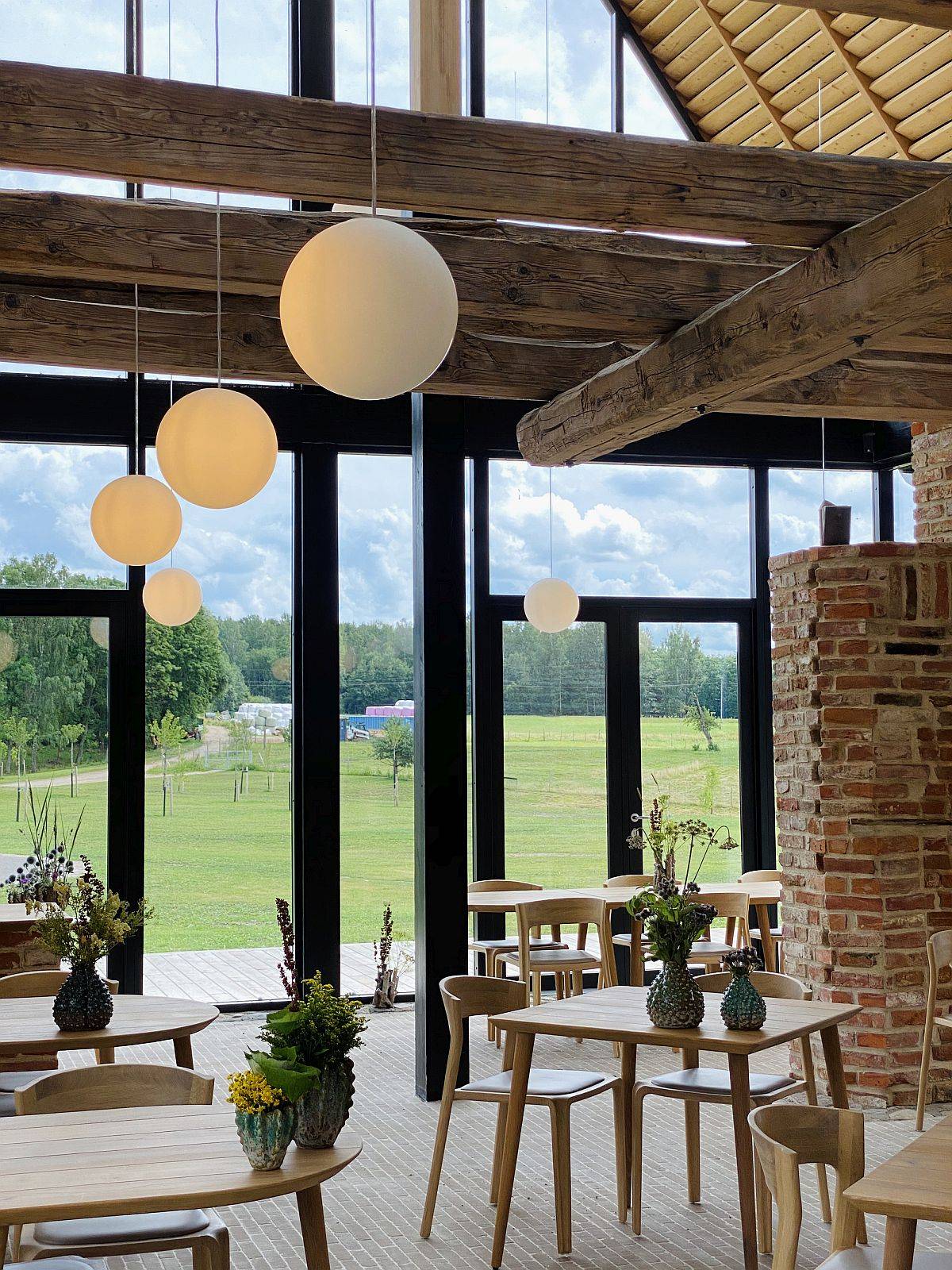 Gorgeous industrial interiors of the building offer wonderful views of the rustic landscape