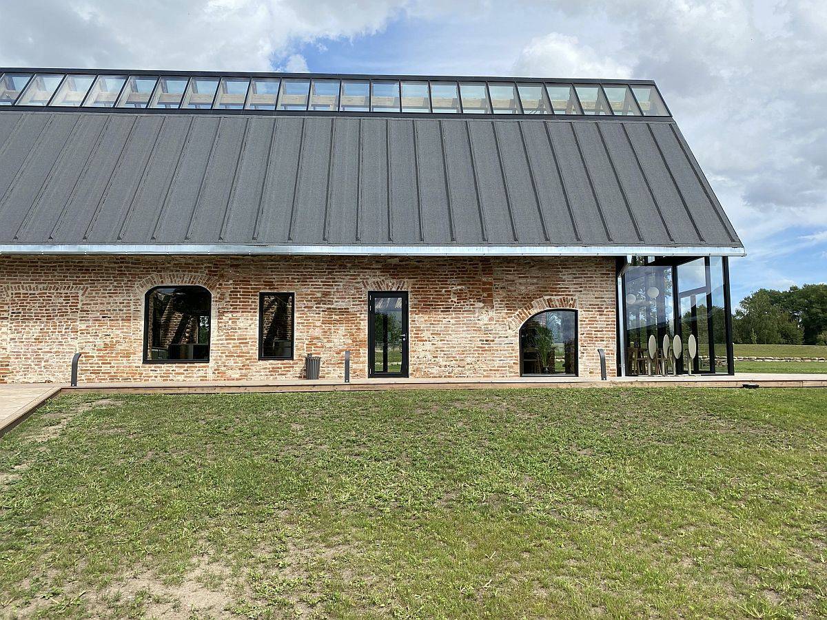 Green lands surround the revived industrial buildings of the Farmers circle in Ukmergė district