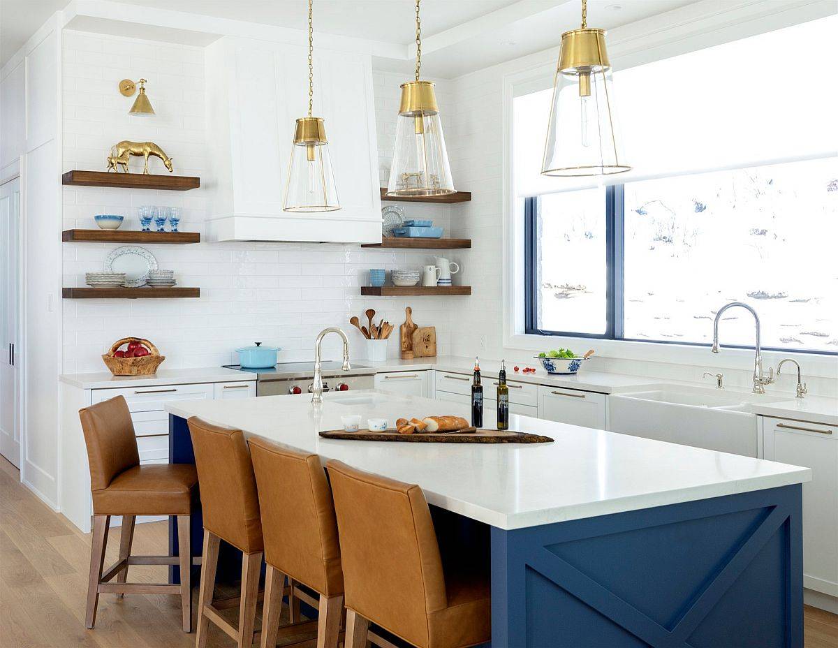 Lovely blue and white kitchen with slim floating shelves that replace traditional upper cabinets