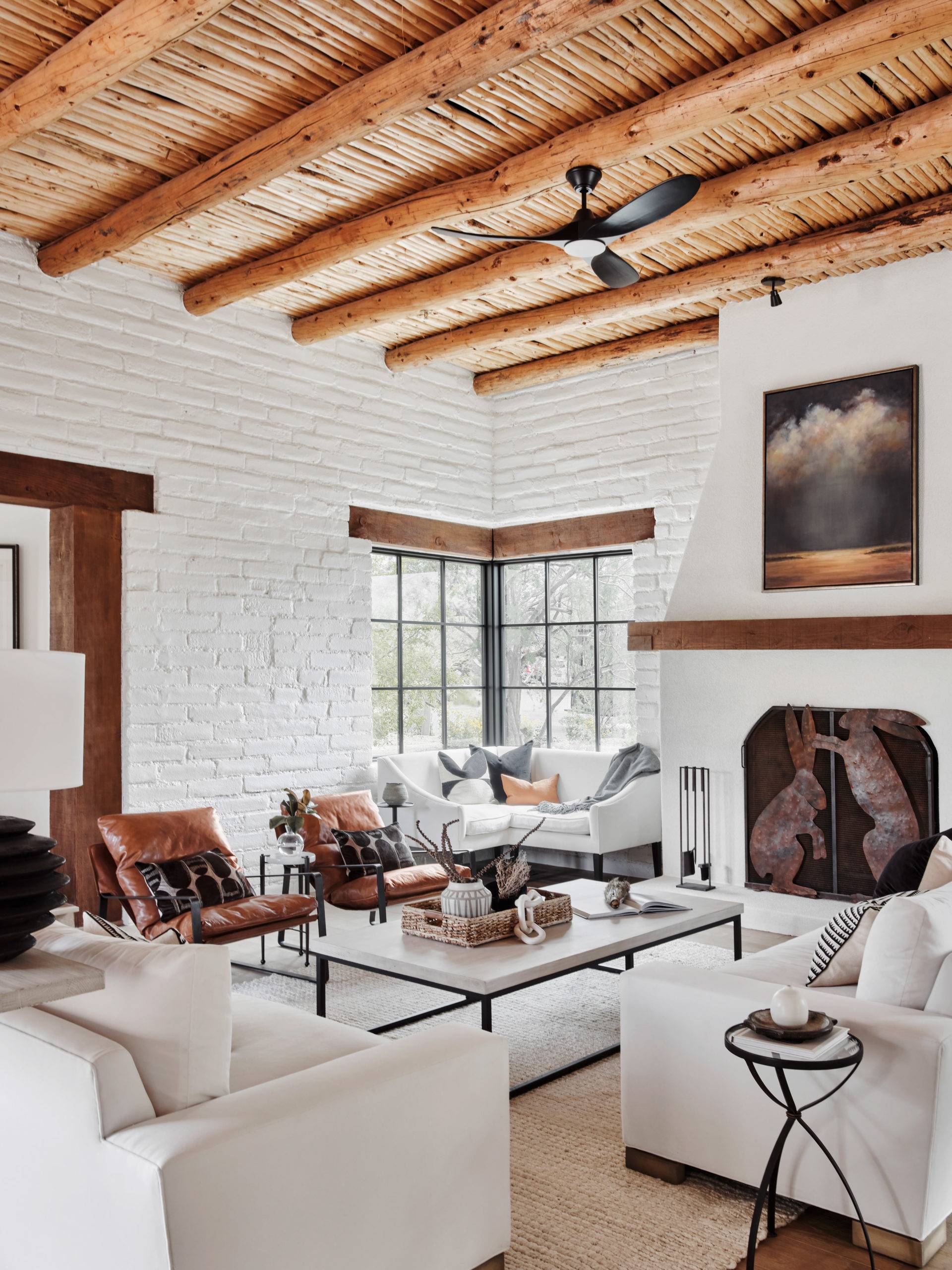 living room with wooden beams and white walls