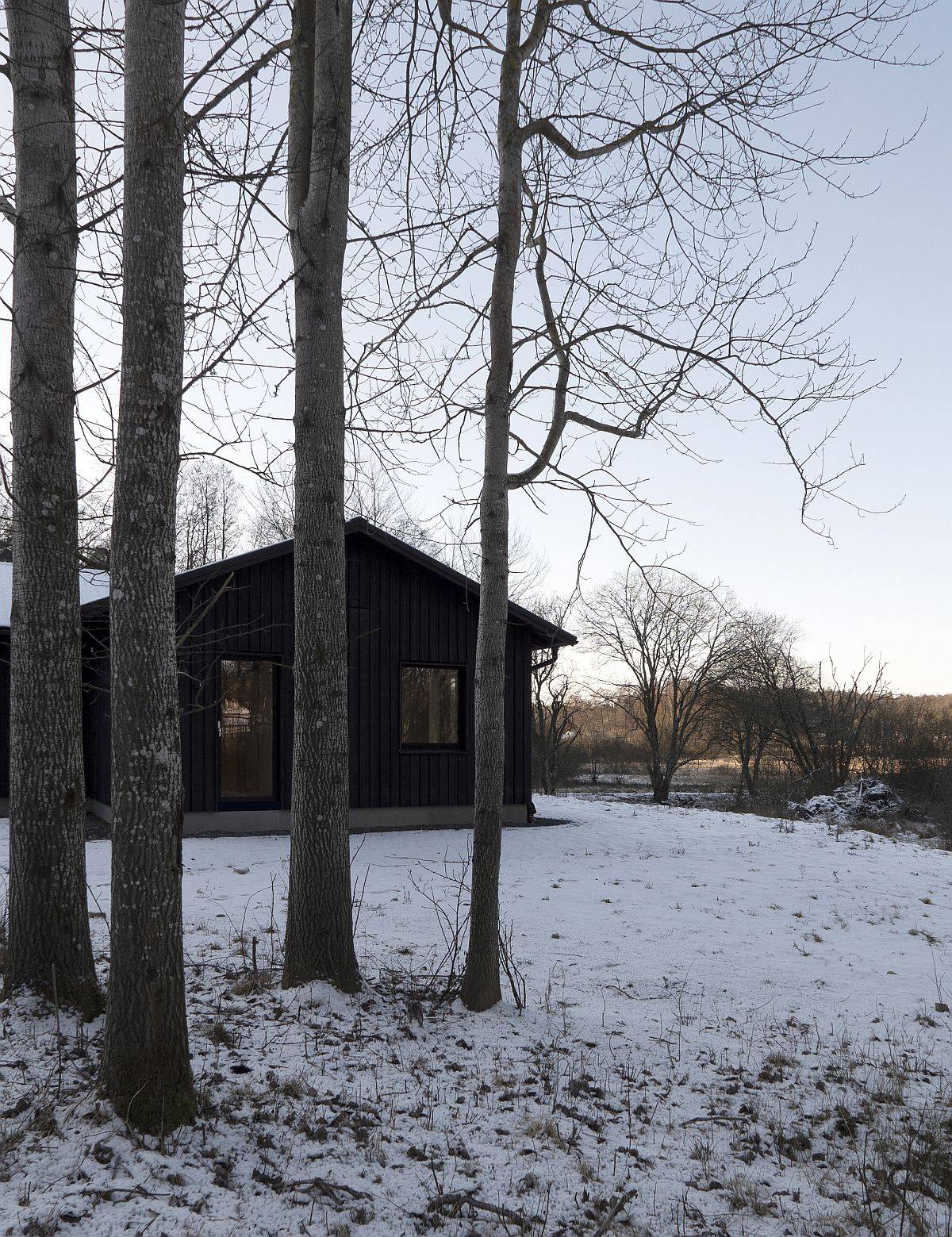 Rustic snow-clad landscape around the countryside home in Sweden