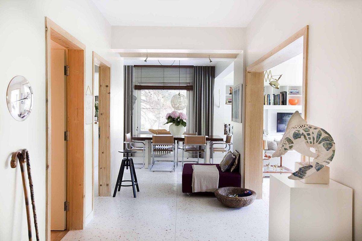 Space-savvy contemporary apartment with terrazzo floor that creates a calming backdrop