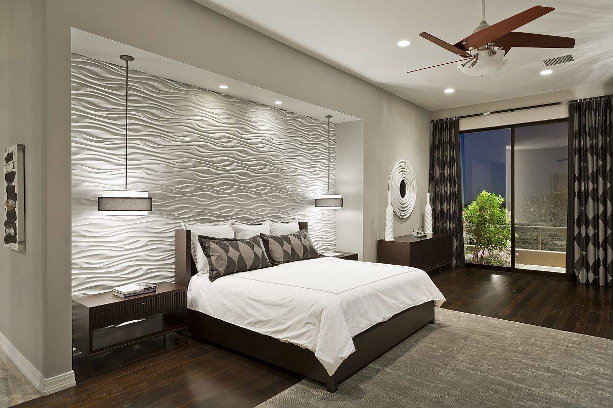 Wavy 3D wall panels create a dashing geo accent wall in this contemporary bedroom