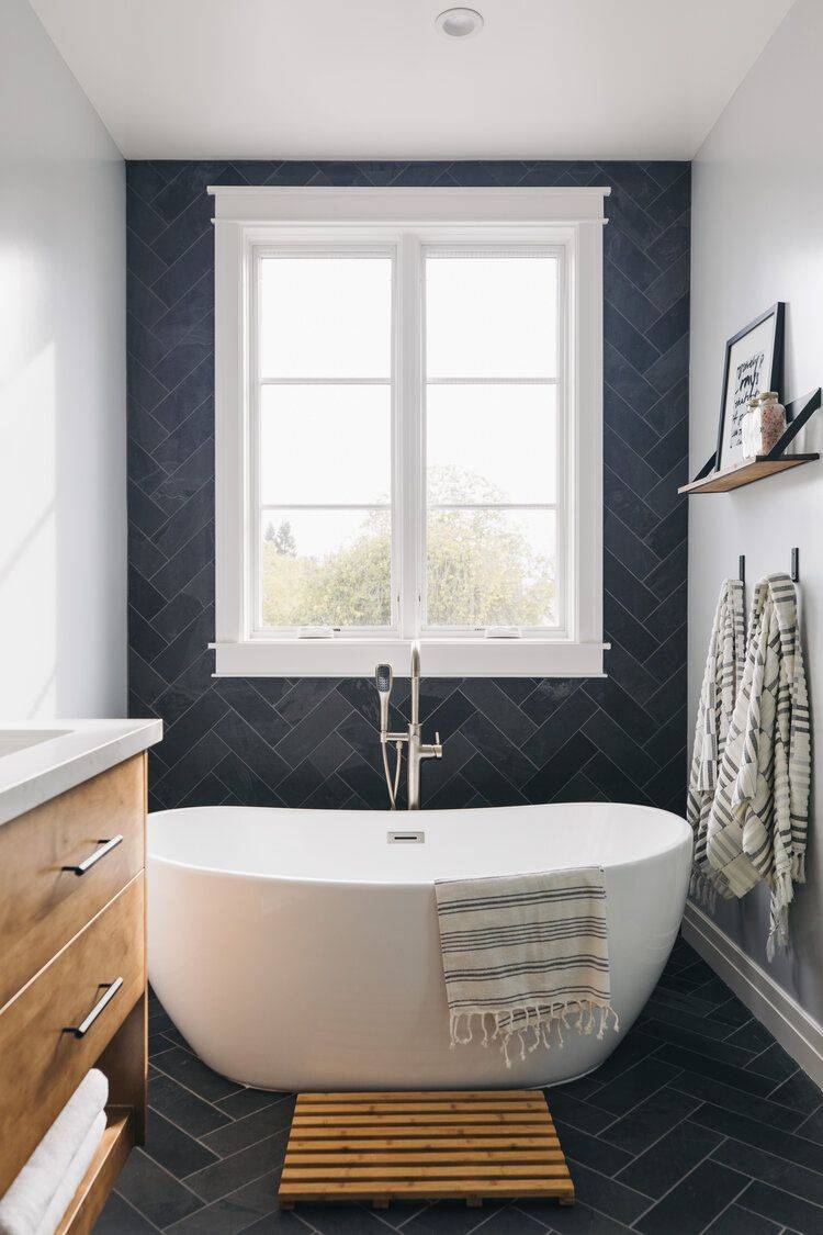 A focal wall with herringbone tile in anthracite is an excellent way to make a visual statement (from The Spruce)
