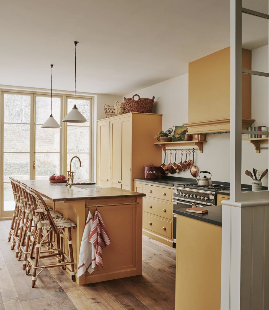 yellow kitchen island stools hanging pendants stove pots