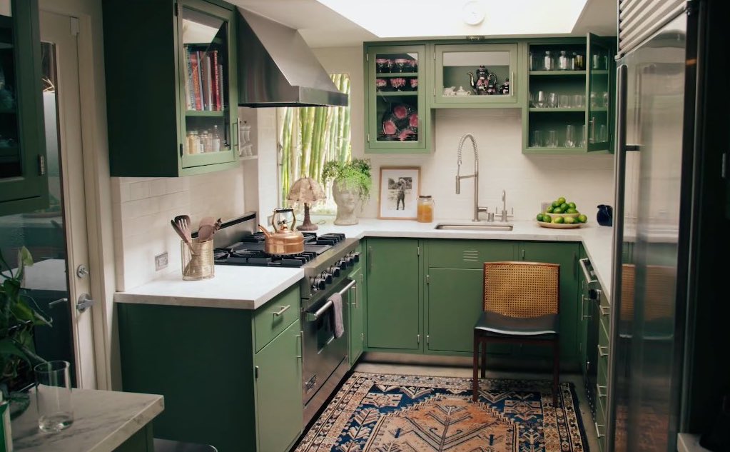 green kitchen carpet chair sink oven faucet open cabinets