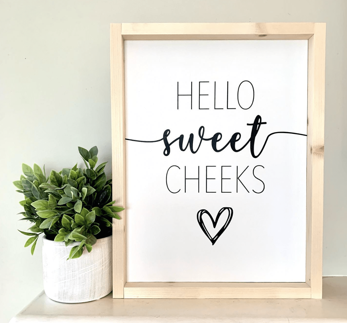 hello sweet cheeks framed wood sign with white background greenery