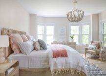 master bedroom large bed pink pillows bay window