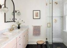 pink vanity black tile mirror gold fixtures walk in shower bathroom