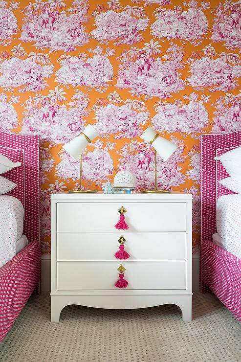 pink and orange wallpaper nightstands tassel drawer pulls lamps white