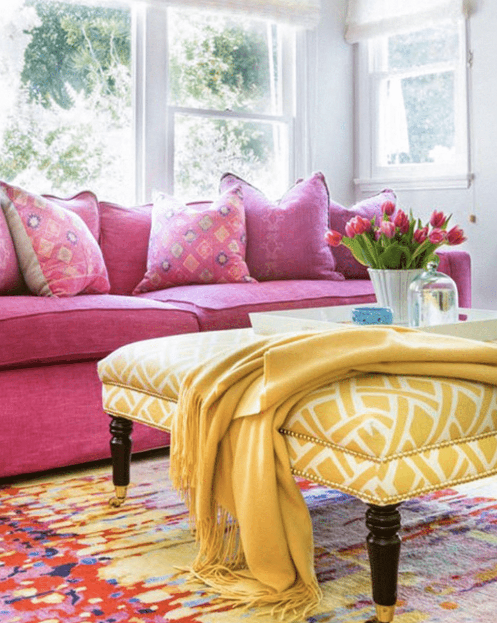 pink couch yellow ottoman throw blanket living room
