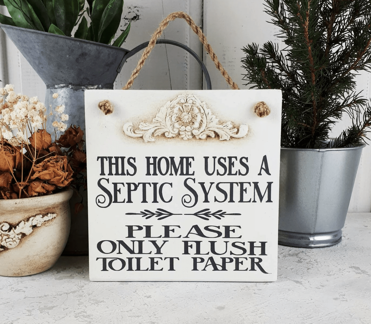 spetic system warning sign for bathroom on wood with hanging rope