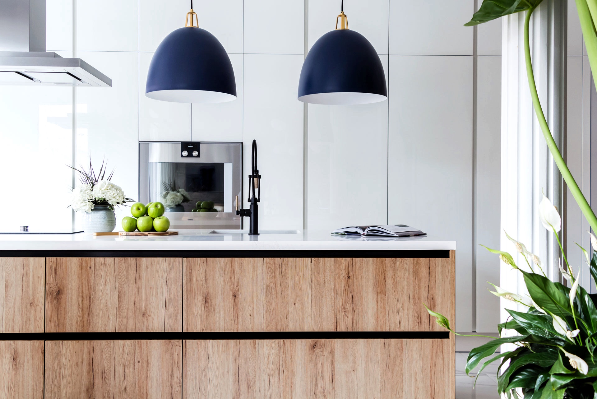 blue pendants kitchen wood island white cabinets