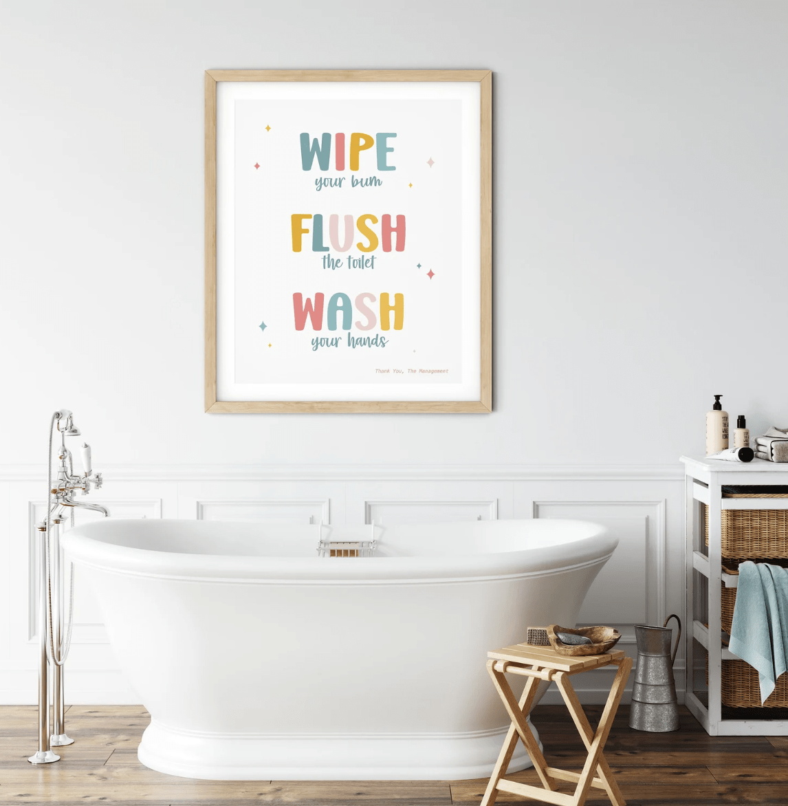 wipe flush wash kids colorful bathroom sign hanging over white freestanding tub with chrome faucets=