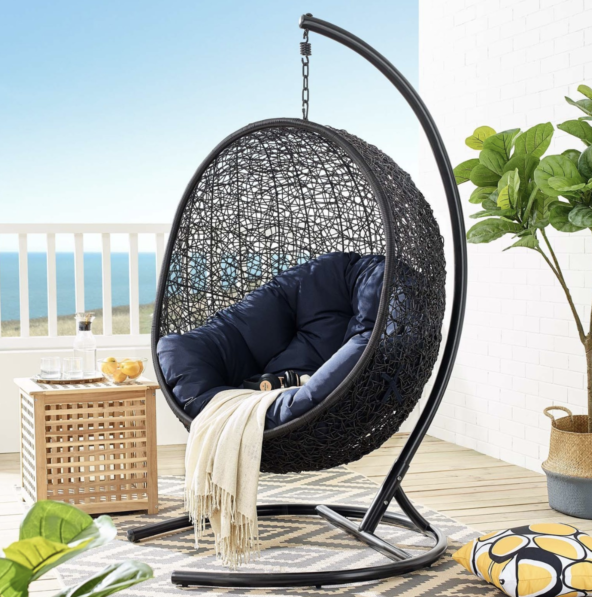 black net hanging egg chair navy blue cushion patio porch