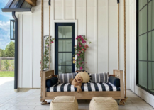 low hanging porch bed black white stripe bed rustic jute ottoman black window white siding