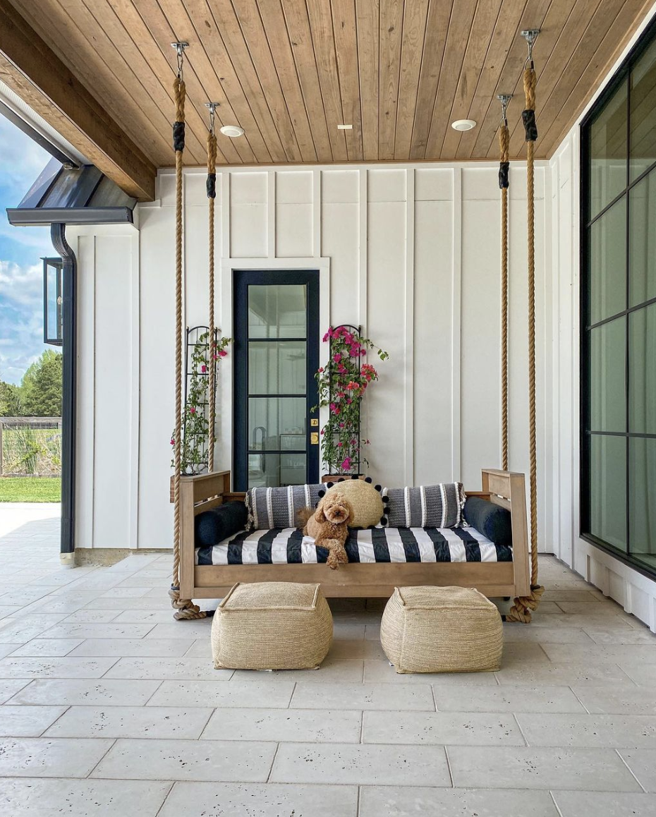 low hanging porch bed black white stripe bed rustic jute ottoman black window white siding