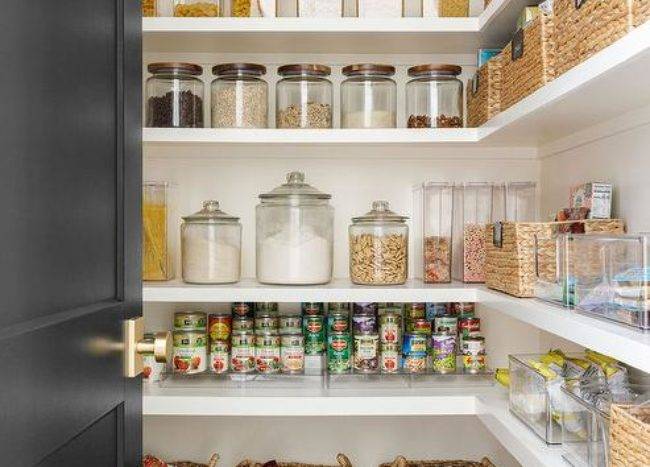 pantry with door open black baskets food storage class jar containers