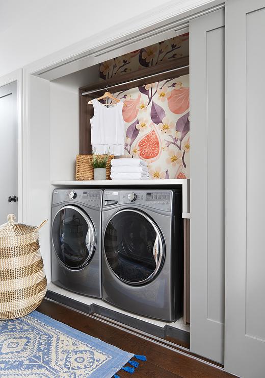 fig wallpaper purple laundry room closet stainless steel washer and dryer side by side seagrass basket clothes rack