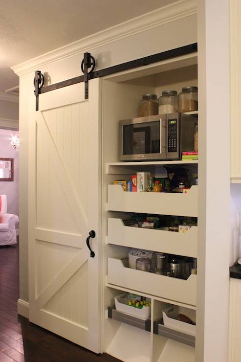pantry closet with sliding barn door white shelving