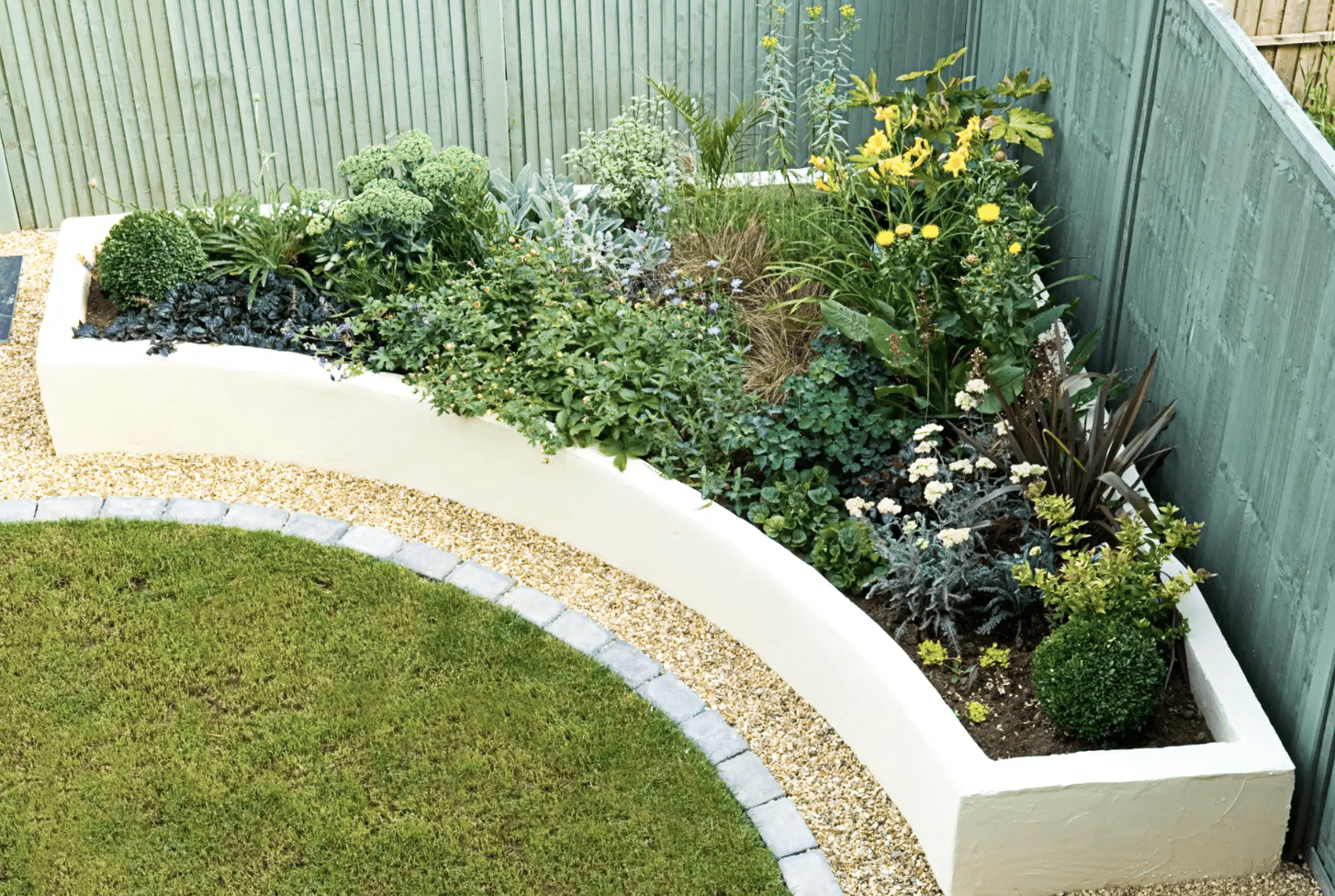 curved garden bed concrete plants planter fence