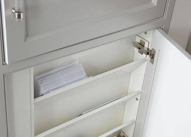 hidden slanted mail holders inside cupboard grey white