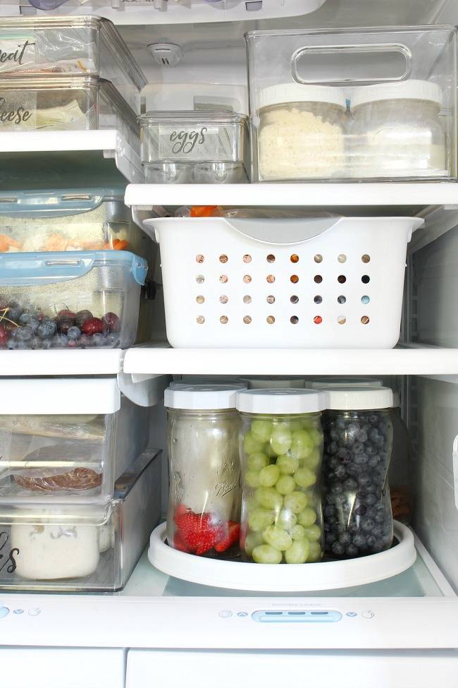 inside of fridge close up plastic bins lazy susan