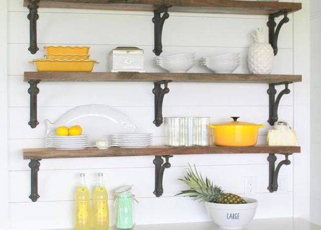open shelves kitchen brown wrought iron brackets yellow dishes