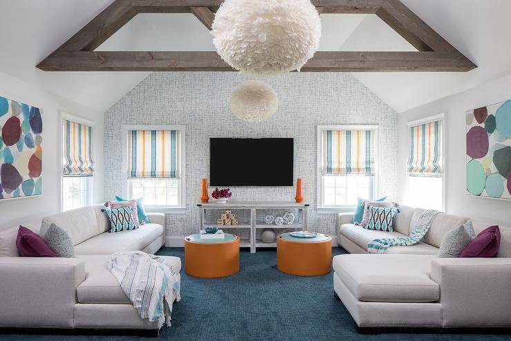teal and orange living room curtains carpet tv wood beams white light
