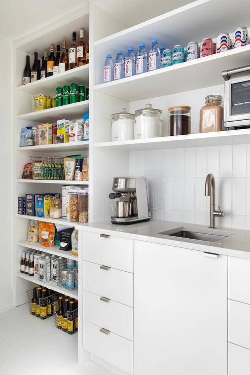 organized pantry lined up products sink coffee maker open shelving