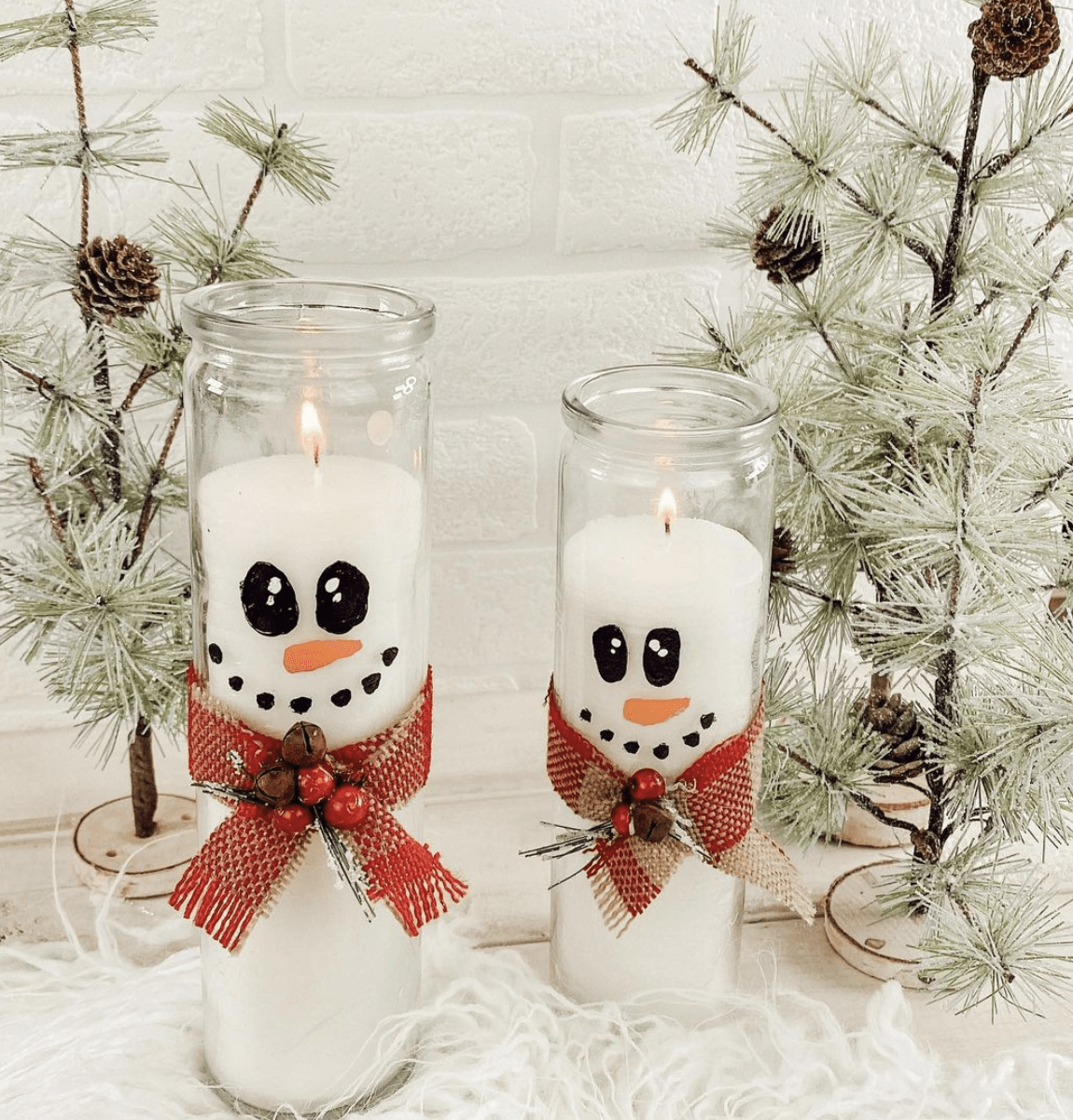 painted snowmen on white votive candles Christmas tree background